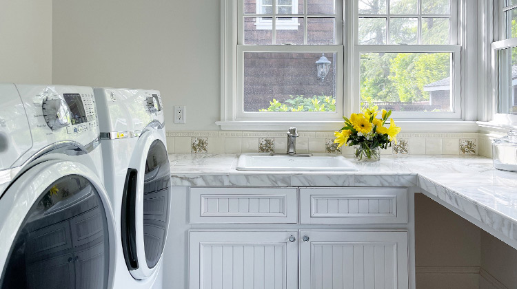 clean laundry room with yellow flowers