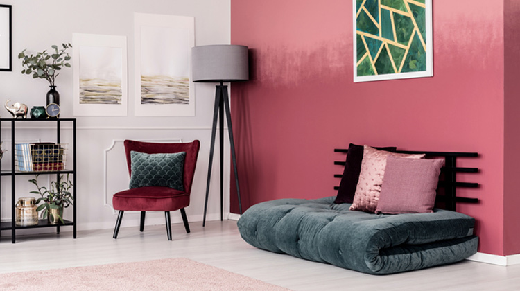 Living room with red walls & floor cushion