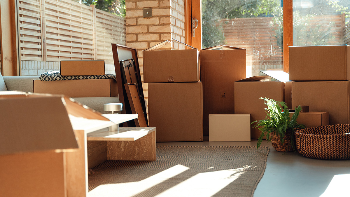 A pile of cardboard boxes in a home.