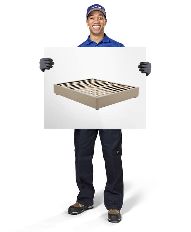 1-800-GOT-JUNK? Truck Team Member holding an image of a box spring